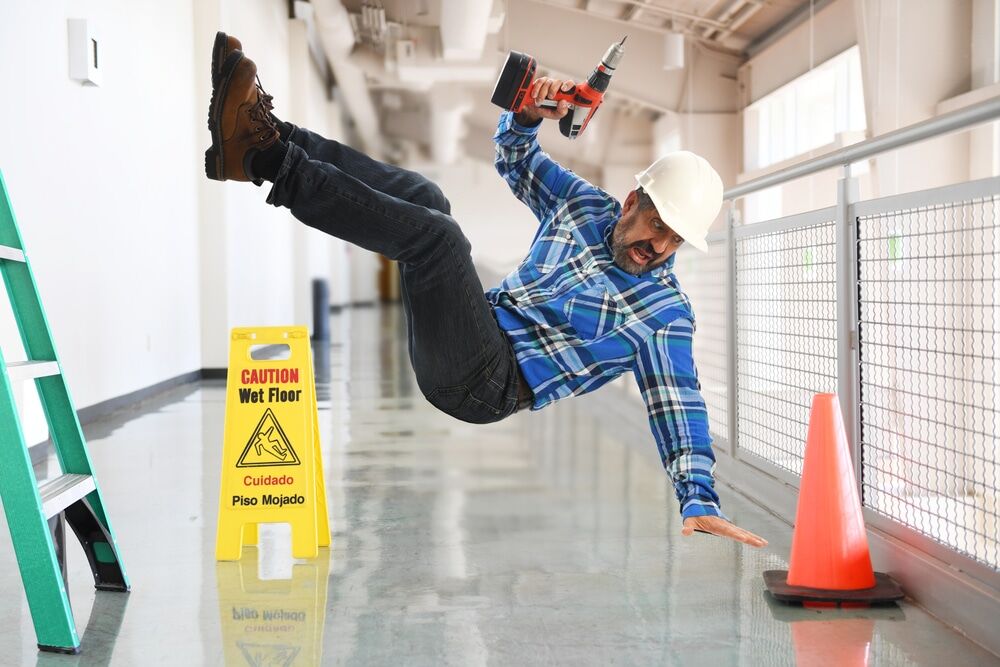 Construction,Worker,Falling,Off,A,Ladder,Inside,A,Building